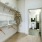 a room with a white wall and a white door with a blue curtain