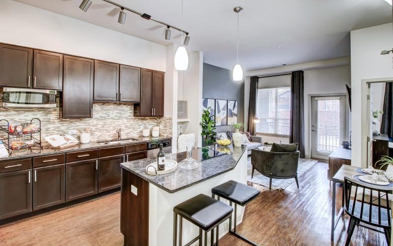 a kitchen with a marble island